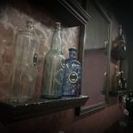 Vintage bottles and hidden decor inside the Speakeasy escape room at Escape It Grandview in Columbus Ohio