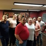 Corporate team building group enjoying a speakeasy escape room experience in Columbus Ohio at Escape It Grandview