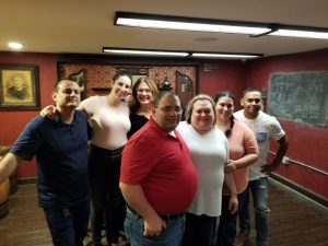 Corporate team building group enjoying a speakeasy escape room experience in Columbus Ohio at Escape It Grandview