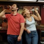 Couple enjoying a fun date night escape room experience in a speakeasy themed room in Columbus Ohio at Escape It Grandview