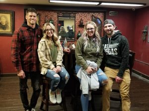 Double date group enjoying a speakeasy escape room experience in Columbus Ohio at Escape It Grandview