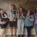 Group celebrating their escape room victory in Columbus Ohio at Escape It Grandview