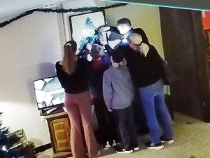 Family group enjoying a Christmas-themed escape room in Columbus Ohio