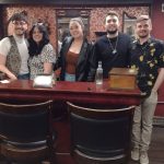 Team building group posing after an escape room experience in Columbus Ohio