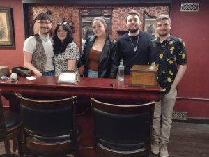 Team building group posing after an escape room experience in Columbus Ohio