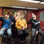 Work team celebrating after completing an escape room in Columbus Ohio at Escape It Grandview