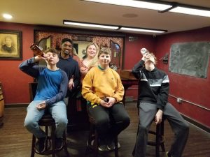 Work team celebrating after completing an escape room in Columbus Ohio at Escape It Grandview